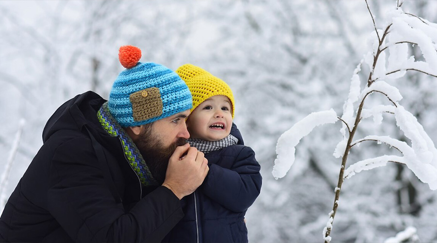 dad and child in snow